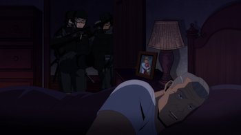 Movie still from “Injustice” (2021), directed by Matt Peters – A group of men standing in a room with a man lying in bed; Wide shot, Over the shoulder angle