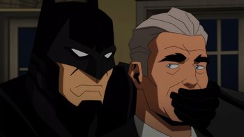 Movie still from “Injustice” (2021), directed by Matt Peters – Two cartoon characters are sitting next to each other; Close Up shot, Over the shoulder angle