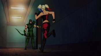 Movie still from “Injustice” (2021), directed by Matt Peters – A woman running in front of an arrow and green arrow; Wide shot, Over the shoulder angle