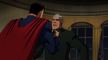 Movie still from “Injustice” (2021), directed by Matt Peters – A man in a suit and a man in a red and blue cape; Medium shot, Over the shoulder angle