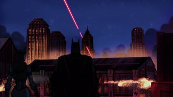 Movie still from “Injustice” (2021), directed by Matt Peters – A batman standing in front of a city at night; Extreme Wide shot, Low angle