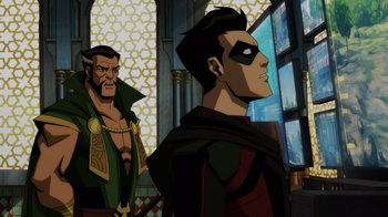 Movie still from “Injustice” (2021), directed by Matt Peters – A man with a beard is standing next to another man with a beard; Medium shot, Over the shoulder angle