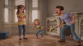 Movie still from “Inside Out” (2015), directed by Pete Docter – A cartoon of a woman and a girl playing with a man; Wide shot, Low angle
