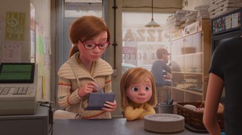 Movie still from “Inside Out” (2015), directed by Pete Docter – A woman and a girl sitting at a table; Medium shot, Over the shoulder angle