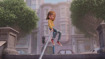 Movie still from “Inside Out” (2015), directed by Pete Docter – A girl is sitting on top of a metal pole in front of a building; Wide shot, Low angle