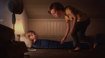 Movie still from “Inside Out” (2015), directed by Pete Docter – An animated scene of a boy and a woman; Wide shot, High angle