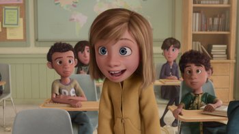 Movie still from “Inside Out” (2015), directed by Pete Docter – A cartoon of a little girl in a class room; Medium shot, Over the shoulder angle