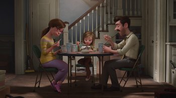 Movie still from “Inside Out” (2015), directed by Pete Docter – A family sitting at a table eating a meal together; Wide shot, High angle