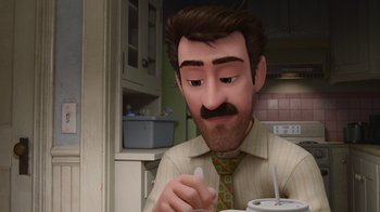 Movie still from “Inside Out” (2015), directed by Pete Docter – A man with a mustache is sitting at a table with a spoon; Close Up shot, High angle