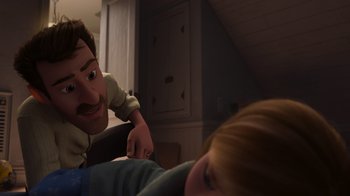 Movie still from “Inside Out” (2015), directed by Pete Docter – A man and a woman are looking at each other in a dark room; Medium shot, Over the shoulder angle