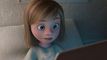 Movie still from “Inside Out” (2015), directed by Pete Docter – A cartoon girl looking at a tablet computer; Close Up shot, Over the shoulder angle