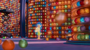 Movie still from “Inside Out” (2015), directed by Pete Docter – An image of an animated character in front of a bunch of balls; Wide shot, Low angle