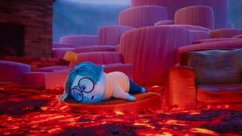 Movie still from “Inside Out” (2015), directed by Pete Docter – An inflated character is sitting in a room filled with fire; Wide shot, High angle