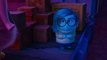 Movie still from “Inside Out” (2015), directed by Pete Docter – A person with a blue wig and a blue sweater; Wide shot, Over the shoulder angle