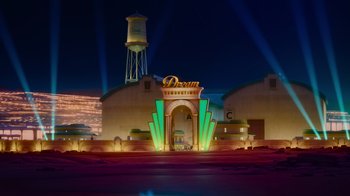 Movie still from “Inside Out” (2015), directed by Pete Docter – A neon sign that reads " dorman theatre " in front of a building; Extreme Wide shot, Low angle