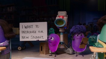 Movie still from “Inside Out” (2015), directed by Pete Docter – A group of purple characters standing next to each other in a room; Wide shot, High angle