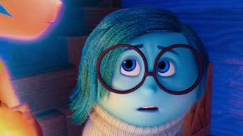 Movie still from “Inside Out” (2015), directed by Pete Docter – An inside out character with glasses; Close Up shot, Over the shoulder angle
