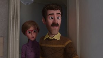 Movie still from “Inside Out” (2015), directed by Pete Docter – A man and a woman standing next to each other; Medium shot, Over the shoulder angle