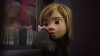 Movie still from “Inside Out” (2015), directed by Pete Docter – A cartoon girl with her head resting on her hand; Close Up shot, Over the shoulder angle