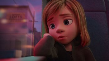 Movie still from “Inside Out” (2015), directed by Pete Docter – A girl with a sad look on her face; Close Up shot, High angle