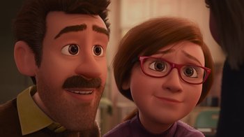 Movie still from “Inside Out” (2015), directed by Pete Docter – A man and a woman are smiling for the camera; Close Up shot, Over the shoulder angle