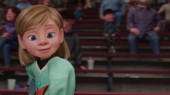 Movie still from “Inside Out” (2015), directed by Pete Docter – A girl is standing in front of a group of people; Medium shot, Over the shoulder angle