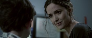 Movie still from “Insidious” (2010), directed by James Wan – A person looking at a mirror; Close Up shot, Over the shoulder angle