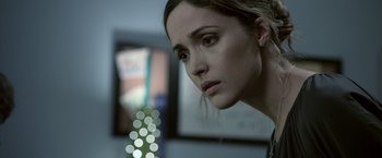 Movie still from “Insidious” (2010), directed by James Wan – A person looking at the camera; Close Up shot, Over the shoulder angle