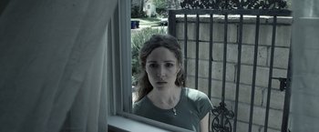 Movie still from “Insidious” (2010), directed by James Wan – A woman standing in front of an open window; Close Up shot, Over the shoulder angle