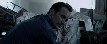 Movie still from “Insidious” (2010), directed by James Wan – A person with blood on his face; Close Up shot, High angle