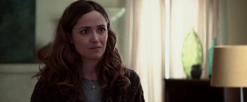 Movie still from “Insidious” (2010), directed by James Wan – A person with a cross on her neck; Close Up shot, Over the shoulder angle