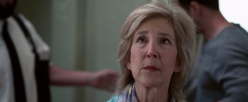 Movie still from “Insidious” (2010), directed by James Wan – An older woman looking up into the air; Close Up shot, Low angle