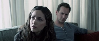 Movie still from “Insidious” (2010), directed by James Wan – A man and a woman sitting next to each other; Close Up shot, Over the shoulder angle