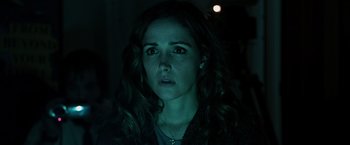 Movie still from “Insidious” (2010), directed by James Wan – A person wearing a necklace; Close Up shot, Over the shoulder angle