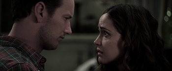 Movie still from “Insidious” (2010), directed by James Wan – A man and a woman face to face in a room; Close Up shot, Over the shoulder angle