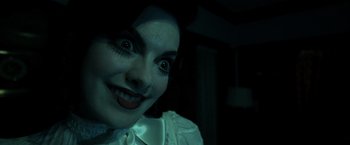 Movie still from “Insidious” (2010), directed by James Wan – A woman's face in the dark; Close Up shot, Over the shoulder angle