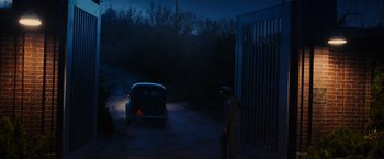 Movie still from “Insidious: The Last Key” (2018), directed by Adam Robitel – A man standing in front of a car in the dark; Extreme Wide shot, High angle