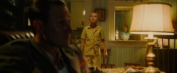 Movie still from “Insidious: The Last Key” (2018), directed by Adam Robitel – A young boy standing in front of an older man; Medium shot, Over the shoulder angle