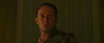 Movie still from “Insidious: The Last Key” (2018), directed by Adam Robitel – A person wearing a uniform; Close Up shot, Low angle