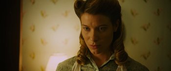 Movie still from “Insidious: The Last Key” (2018), directed by Adam Robitel – A person wearing a dress shirt; Close Up shot, Low angle