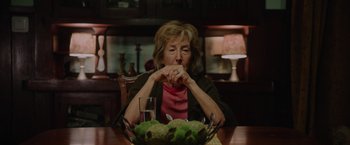 Movie still from “Insidious: The Last Key” (2018), directed by Adam Robitel – An older woman sitting at a table with a bowl of fruit; Close Up shot, Over the shoulder angle