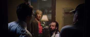 Movie still from “Insidious: The Last Key” (2018), directed by Adam Robitel – A group of people standing in front of a mirror; Medium shot, Over the shoulder angle