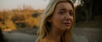 Movie still from “Insidious: The Last Key” (2018), directed by Adam Robitel – A person with long blonde hair; Close Up shot, Over the shoulder angle