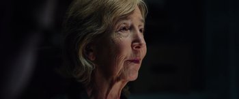 Movie still from “Insidious: The Last Key” (2018), directed by Adam Robitel – An older woman looking off into the distance; Close Up shot, Low angle
