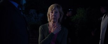 Movie still from “Insidious: The Last Key” (2018), directed by Adam Robitel – An older woman is holding her hands to her chest; Close Up shot, Over the shoulder angle
