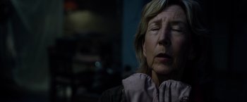 Movie still from “Insidious: The Last Key” (2018), directed by Adam Robitel – An older woman with her eyes closed; Close Up shot, Over the shoulder angle
