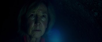 Movie still from “Insidious: The Last Key” (2018), directed by Adam Robitel – An older woman is looking at the camera; Close Up shot, Low angle
