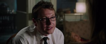 Movie still from “Insidious: The Last Key” (2018), directed by Adam Robitel – A person wearing a shirt and tie; Close Up shot, Over the shoulder angle