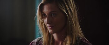 Movie still from “Insidious: The Last Key” (2018), directed by Adam Robitel – A person with long blonde hair; Close Up shot, Over the shoulder angle