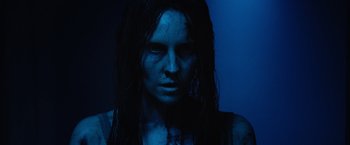 Movie still from “Insidious: The Last Key” (2018), directed by Adam Robitel – A person with long black hair; Close Up shot, Low angle